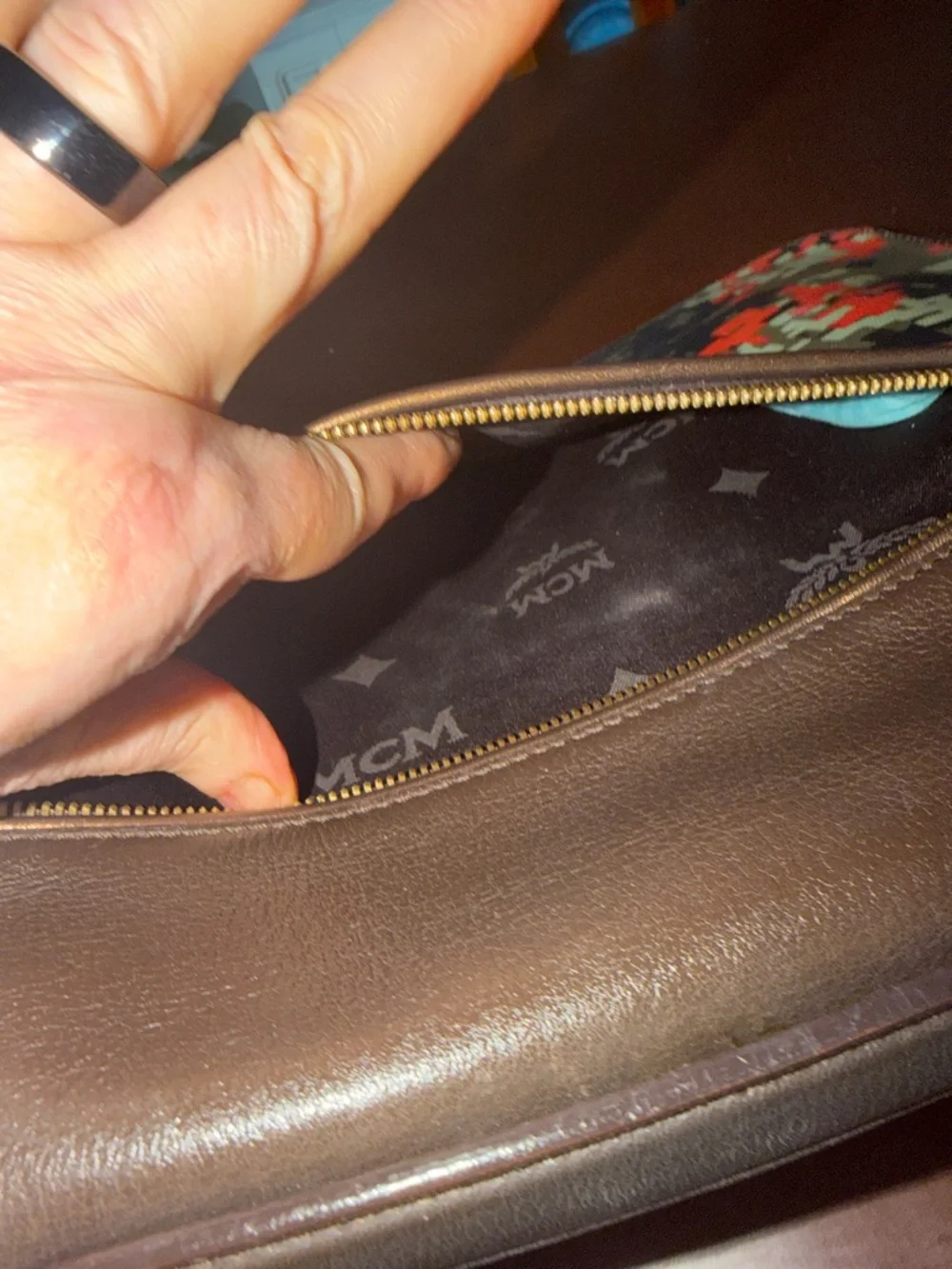MCM laptop portfolio with brown leather trim and digital camo fabric